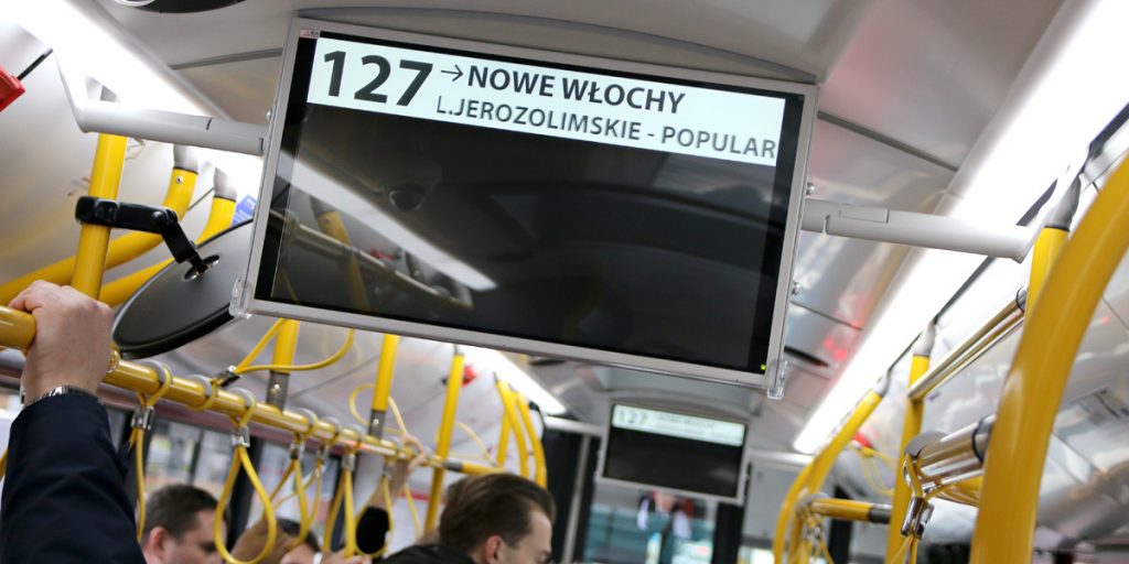 Vehicle's internal display showing line number, driving direction and route. Additionally, the names of the current and next stops are displayed.